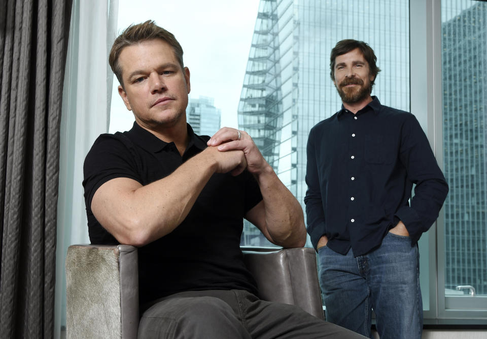 This Sept. 8, 2019 photo shows co-stars Matt Damon, left, and Christian Bale posing for a portrait to promote their film "Ford v Ferrari," at the St. Regis Hotel during the Toronto International Film Festival. The film, directed by James Mangold, hits theaters on Nov. 15. (Photo by Chris Pizzello/Invision/AP)