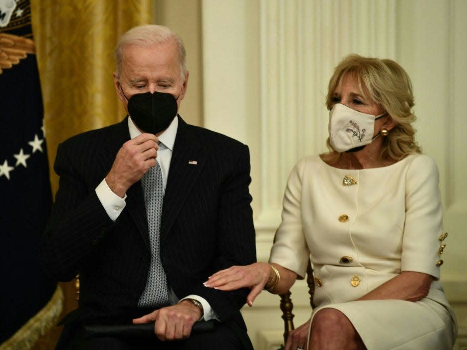 Jill Biden rests her hand on Joe Biden's arm at the Cancer Moonshot relaunch.