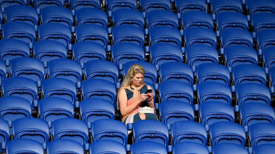 A woman, pictured here before the start of Naomi Osaka's match against Anastasia Pavlyuchenkova.