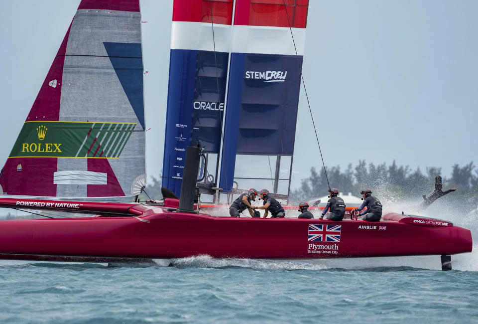 In this photo provided by SailGP, the Britain SailGP Team presented by INEOS, helmed by Sir Ben Ainslie, race toward the finish line in first place in the final race on race Day 2 of the Bermuda SailGP event in Hamilton, Bermuda, Sunday, April 25, 2021. (Bob Martin/SailGP via AP)