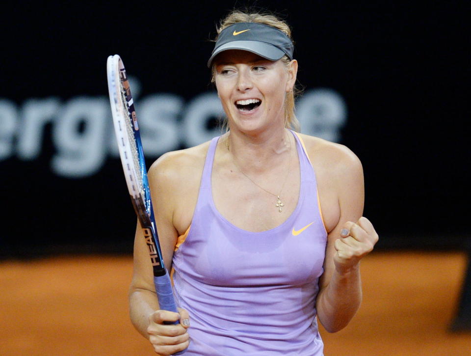 Russia's Maria Sharapova celebrates after winning her semifinal match against Sara Errani of Italy at the Porsche tennis Grand Prix in Stuttgart, Germany, Saturday, April 26, 2014. Sharapova won the match with 6-1 and 6-2. (AP Photo/dpa, Bernd Weissbrod)