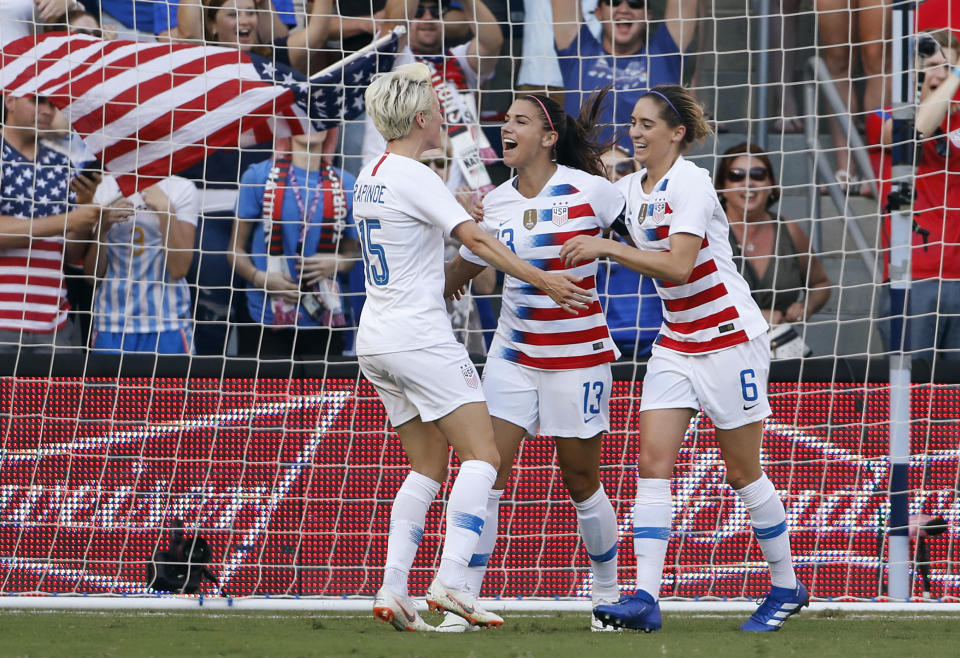 United States' Megan Rapinoe (15) and Morgan Brian (6) congratulates Alex Morgan (13) after she scored against Japan in the first half of a Tournament of Nations soccer match in Kansas City, Kan., Thursday, July 26, 2018. (AP Photo/Colin E. Braley)