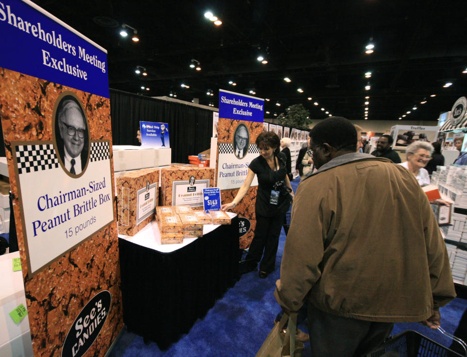 A Berkshire Hathaway shareholder examines, April 30, 2011 Warren Buffett branded peanut brittle at the company's annual meeting in Omaha, Nebraska -- a meeting sometimes dubbed the "Woodstock of capitalism."   Billionaire investor Warren Buffett sought to draw a line Saturday under a controversy sullying his normally Teflon image, blasting a key lieutenant's behavior as "inexplicable and inexcusable."  The revered magnate, who 20 years ago vowed to ruthlessly deal with staff who tarnish his firm's reputation, told a stadium full of attentive shareholders that David Sokol had broken company rules in a share-trading scandal.  Once Buffett's heir apparent, Sokol resigned after it emerged he bought $10 million worth of shares in chemicals firm Lubrizol before recommending Buffett's Berkshire Hathaway group snap up the company. He gained an estimated $3 million from the deal.   AFP PHOTO / Andrew BEATTY (Photo credit should read Andrew BEATTY/AFP via Getty Images)