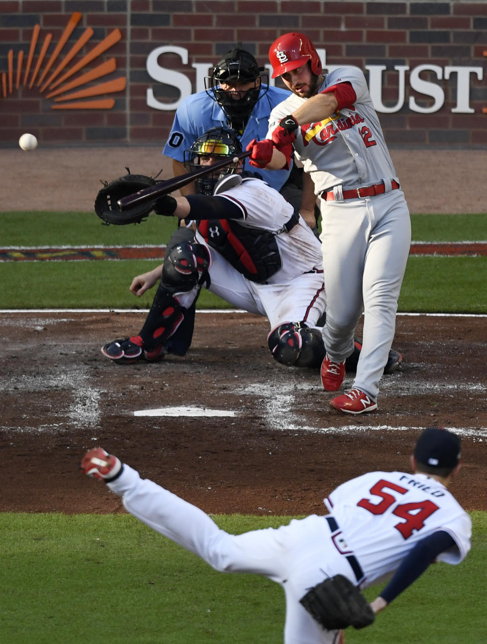 St. Louis Cardinals' Paul DeJong hits a double to score teammate Tommy Edman off Atlanta Braves pitcher Max Fried (54) during the second inning of Game 5 of their National League Division Series baseball game Wednesday, Oct. 9, 2019, in Atlanta. (AP Photo/Danny Karnik)