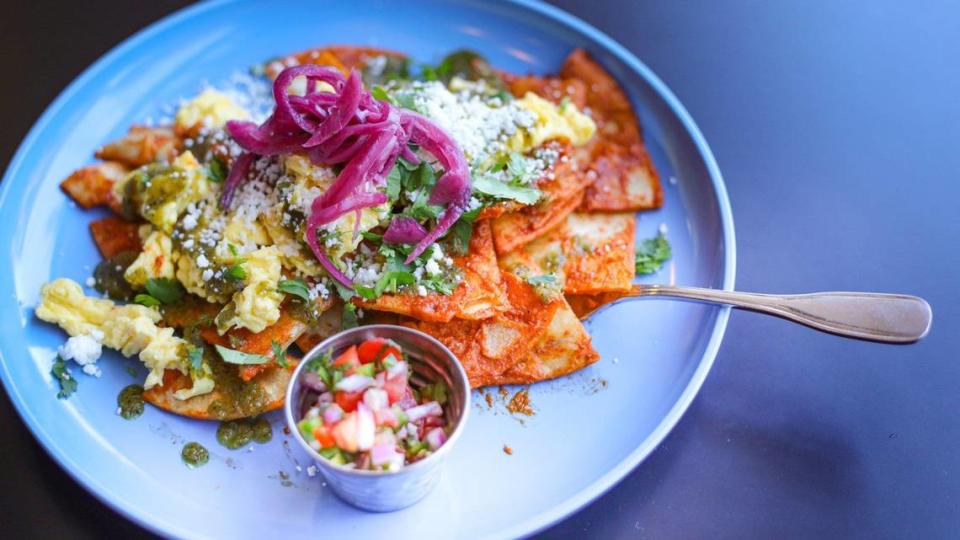 Chilaques with red sauce, scrambled egg, quest fresco, cilantro, pickled onion and green salsa are among the recent breakfast menu options at Corazon Cafe in San Luis Obispo.