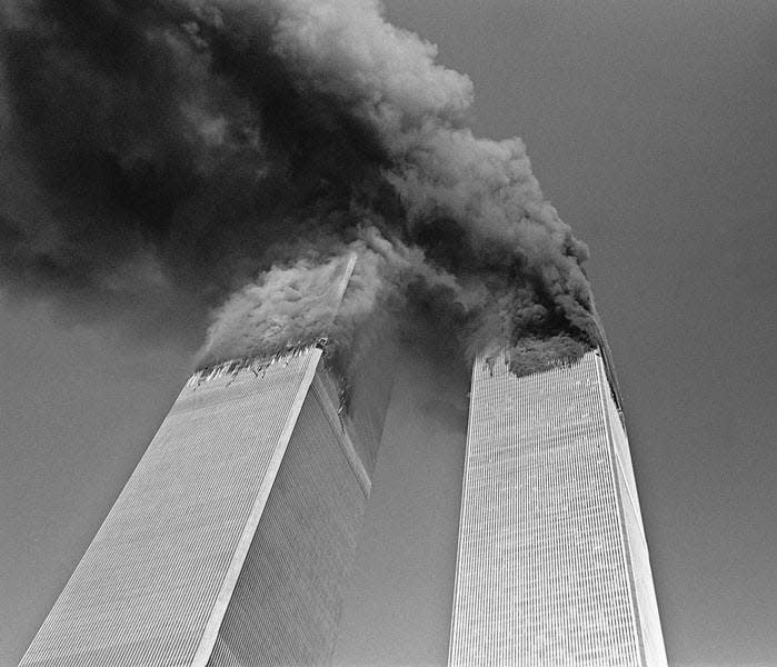 Smoke billows from the twin towers of the World Trade Center in New York in this Sept. 11, 2001, file photo. A beam from the World Trade Center will be on display in South Bend Thursday. AP File Photo/Gulnara Samoilova