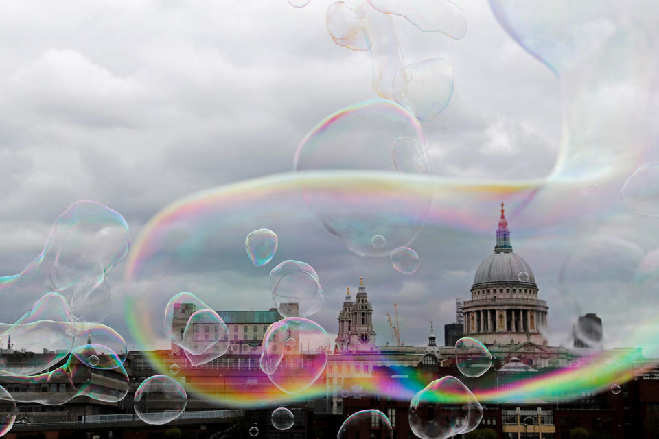 Soap bubbles float past St Paul’s Cathedral