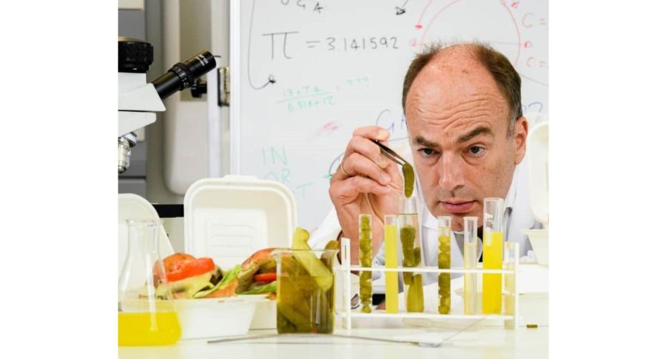 Professor Charles Spence looking at pickles in test tubes