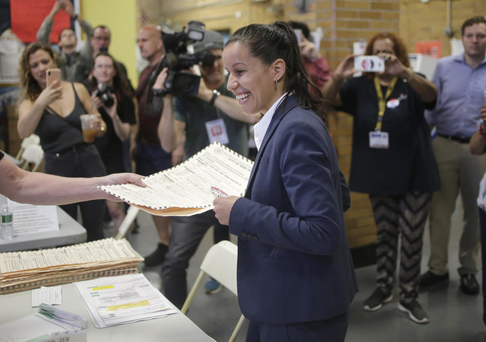 Queens district attorney candidate Tiffany Caban receives her ballot at her polling place in the Queens borough of New York, Tuesday, June 25, 2019. The race for district attorney of the New York City borough of Queens is shaping up as a battle between moderate Democrats and the left wing of the party. The winner will be strongly favored to win a November general election to succeed the late District Attorney Richard Brown. (AP Photo/Seth Wenig)