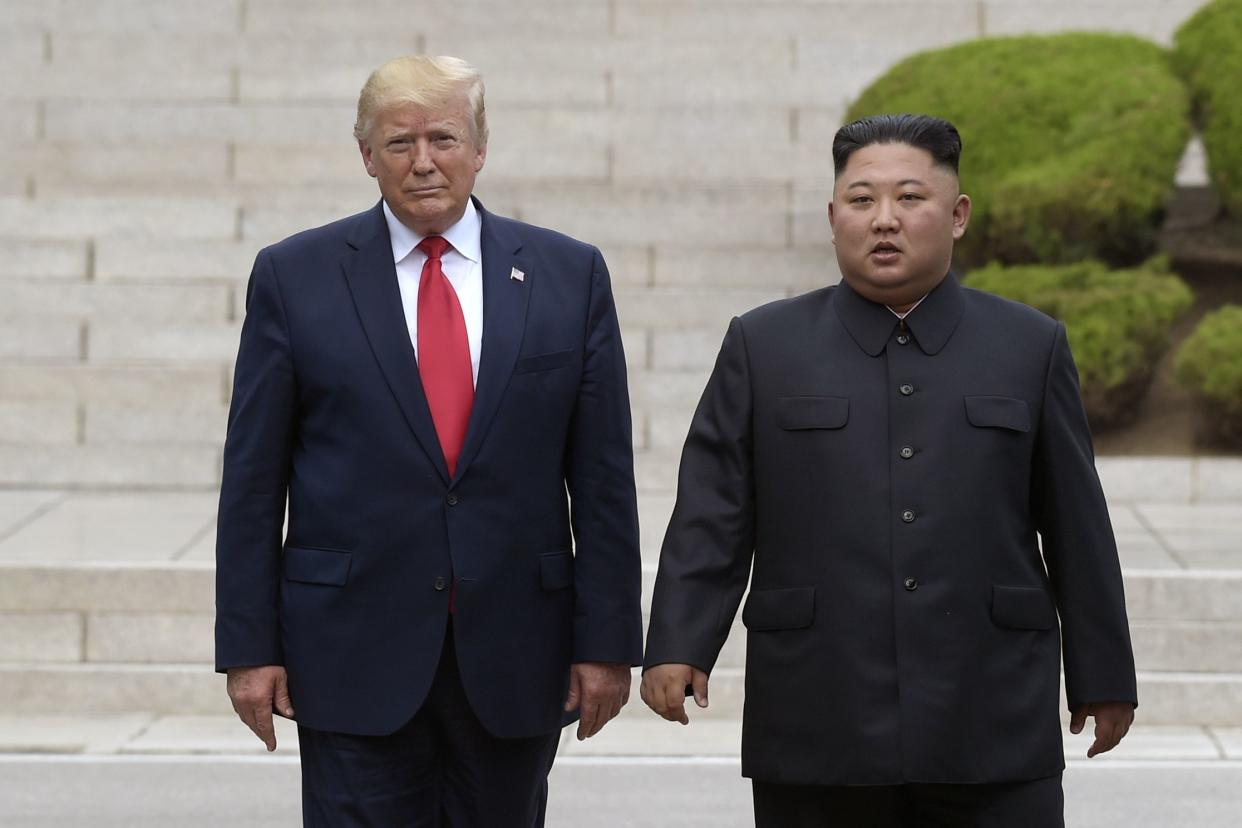 Then U.S. President Donald Trump (left) meets with North Korean leader Kim Jong Un at the North Korean side of the border at the village of Panmunjom in the Demilitarized Zone, on June 30, 2019. 