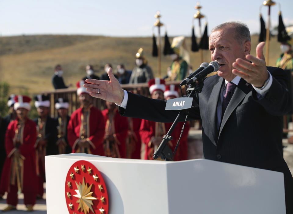 Turkey's President Recep Tayyip Erdogan speaks addresses during a ceremony in Ahlat, eastern Turkey, Wednesday, Aug. 25, 2021. Turkey has begun to evacuate its troops from Afghanistan after nearly 20 years in the country, the Defense Ministry said Wednesday. Erdogan said Turkey would treat the Taliban's future statements with "cautious optimism". "The Taliban's actions and steps will determine the shape of the next stage in Afghanistan, not the words of the Taliban," he told a meeting in Ahlat. (Turkish Presidency via AP, Pool)