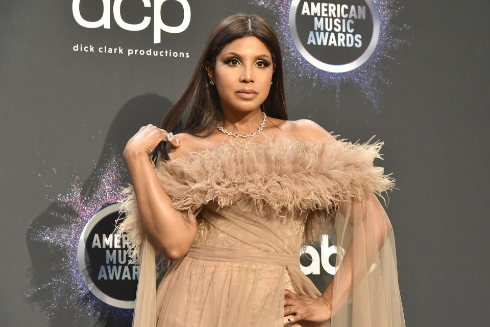 Toni Braxton posing on a red carpet