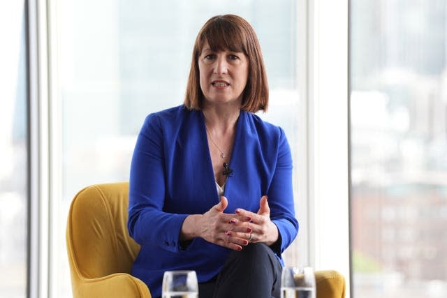 Rachel Reeves sits in a chair and speaks to the audience during a question and answer session