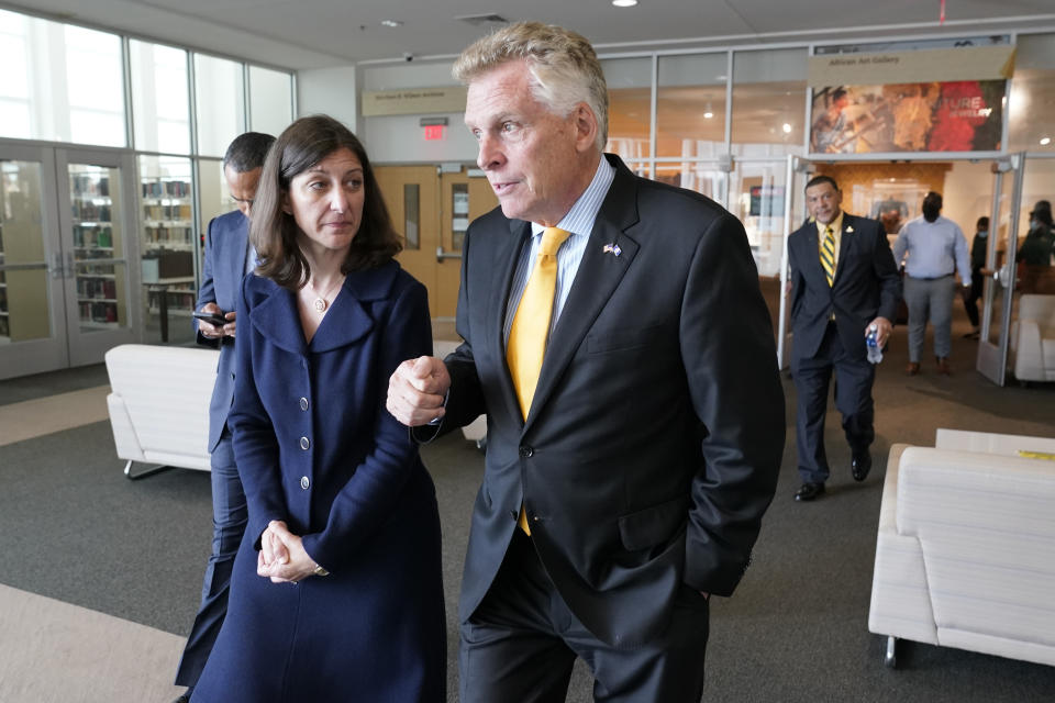 In this July 15, 2021, photo, Rep. Elaine Luria, D-Va., left, talks with Democratic gubernatorial candidate Terry McAuliffe, during a tour of Norfolk State University in Norfolk, Va. Republicans and Democrats have something in common when it comes to recruiting candidates they hope will deliver majorities in Congress after the 2022 election, and that's military veterans. (AP Photo/Steve Helber)