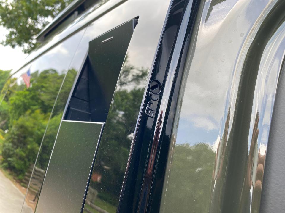 The lockable concealed grab handles on the c-pillar of a 2024 Hyundai Santa Fe SUV.