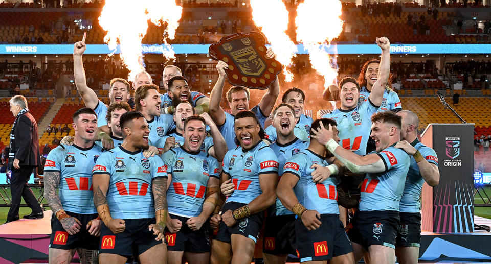 Seen here, NSW Blues captain Jake Trbojevic lifts the State of Origin shield after his side's 14-4 win over the Maroons in Game 3. 