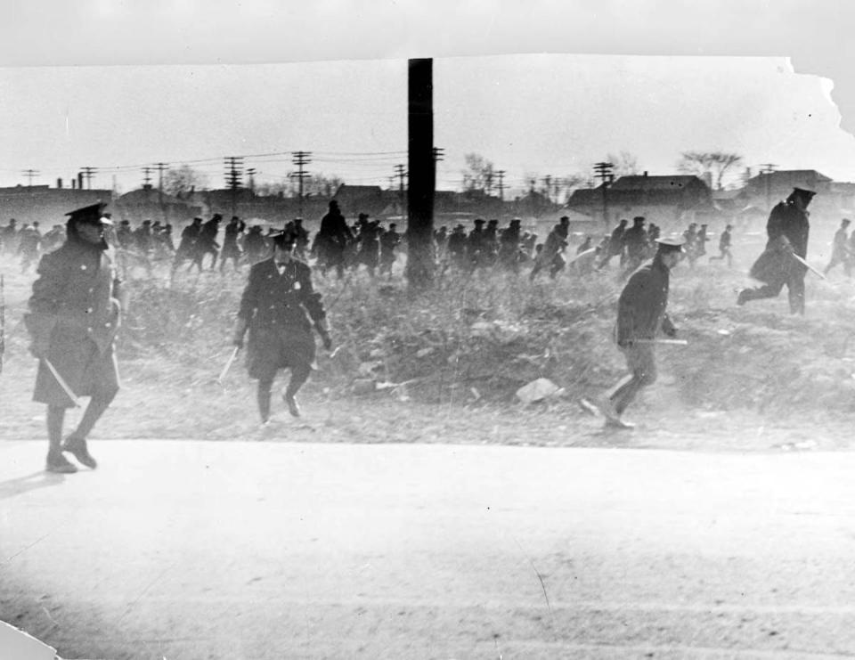 Police with bats follow Hunger March marchers on March 7, 1932.