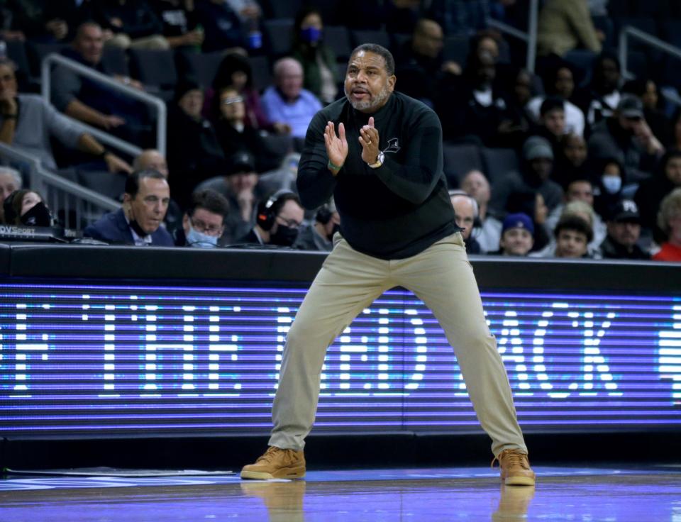 Providence College men's basketball coach Ed Cooley cheers on his players from the sideline during the game against New Hampshire on Nov. 18 at the Dunkin' Donuts Center. Cooley won his 200th career game on Saturday against St. Peter's to join only Joe Mullaney and Dave Gavitt with that total.