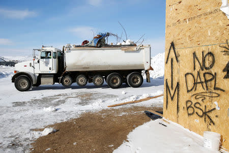 Crews remove waste from the opposition camp against the Dakota Access oil pipeline near Cannon Ball, North Dakota, U.S., February 8, 2017. REUTERS/Terray Sylvester