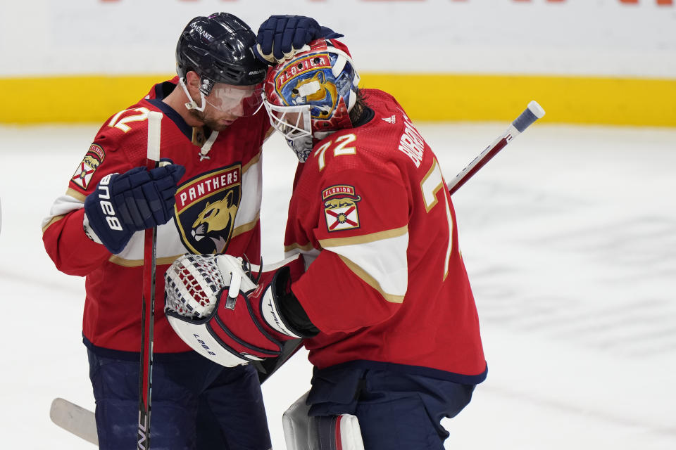 Florida Panthers center Eric Staal (12) and goaltender Sergei Bobrovsky (72) celebrate after the Panthers beat the Pittsburgh Penguins 4-1 in an NHL hockey game, Saturday, March 4, 2023, in Sunrise, Fla. (AP Photo/Wilfredo Lee)