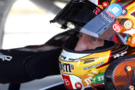 FILE - In this Sept. 26, 2021, file photo, Kyle Busch waits in his car before a NASCAR Cup Series auto race at the Las Vegas Motor Speedway in Las Vegas. A four-time winner at Texas Motor Speedway, Busch will be without crew chief Ben Beshore after his suspension for two two loose lug nuts on the No. 18 Toyota after last week’s road-course race in Charlotte. (AP Photo/Steve Marcus, File)