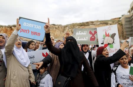 Israeli Arab women protesters shout slogans during a demonstration against the outlawing of the Islamic Movement's northern branch, in the northern Israeli-Arab town of Umm el-Fahm November 28, 2015. REUTERS/Ammar Awad