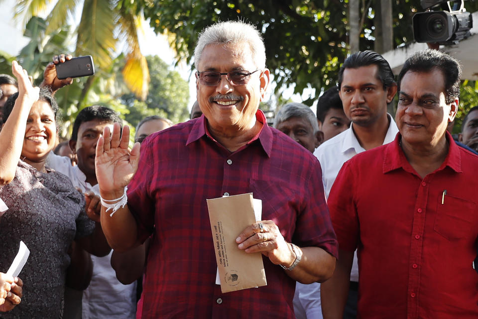 Sri Lanka's former Defense Secretary and presidential candidate Gotabaya Rajapaksa arrives to cast his vote at a polling center in Embuldeniya, on the outskirts of Colombo, Sri Lanka, Saturday, Nov. 16, 2019. Polls opened in Sri Lanka’s presidential election Saturday after weeks of campaigning that largely focused on national security and religious extremism in the backdrop of the deadly Islamic State-inspired suicide bomb attacks on Easter Sunday. (AP Photo/Eranga Jayawardena)