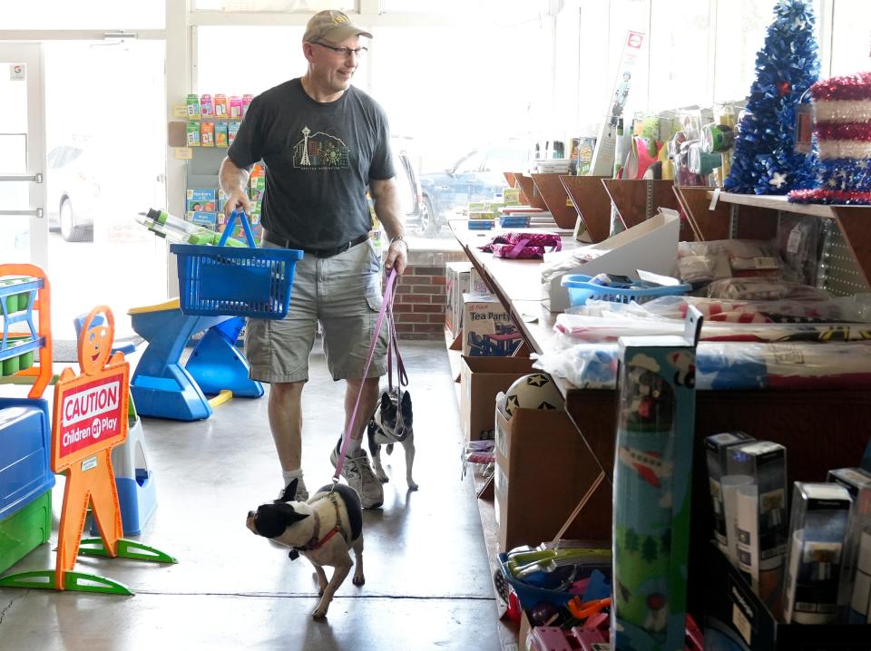 Bruce Davis of of Grandview shopped Star Beacon Products with his Boston terriers Adele and Layla, on Tuesday after the store announced that it was closing. Davis estimates he has been shopping at Star Beacon for 40 years.