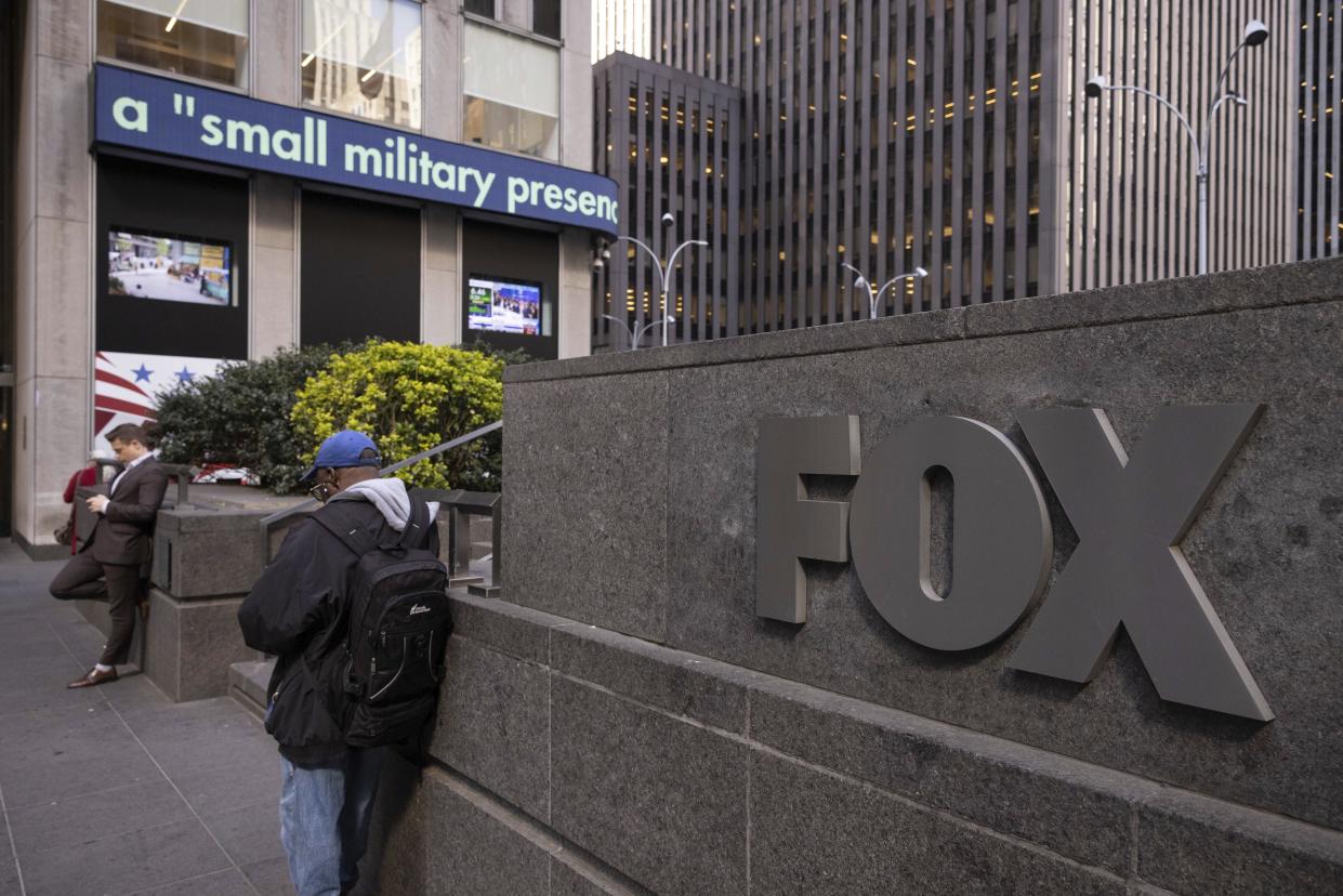 FILE - A logo of Fox News is displayed outside Fox News Headquarters in New York, Wednesday, April. 12, 2023. Dominion Voting Systems' defamation lawsuit against Fox News for airing bogus allegations of fraud in the 2020 election is set to begin trial on Monday, April 17, 2023, in Delaware.(AP Photo/Yuki Iwamura, File)