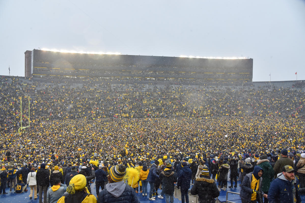 ANN ARBOR, MI - NOVEMBER 27: Michigan fans rush the field celebrating the 42-27 victory by The Michigan Wolverines vs the Ohio State Buckeyes game on Saturday November 27, 2021 at Michigan Stadium in Ann Arbor, MI. (Photo by Steven King/Icon Sportswire via Getty Images)