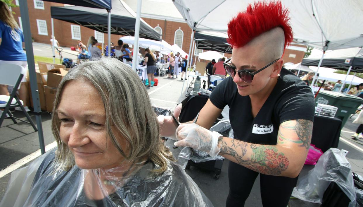 Rhonda Chapman gets a free hair cut from Lindsay Henderson at the Paul Mitchel tent during Hope Fest held Thursday, June 30, 2022, at First United Methodist Church of Gastonia on East Franklin Boulevard.