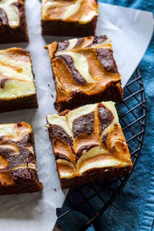 <p>Chocolate with Grace</p><p>Rich chocolate pumpkin brownies swirled with a pumpkin cheesecake layer! </p><p><strong>Get the recipe: <em><a href="http://chocolatewithgrace.com/pumpkin-cheesecake-swirled-brownies/" rel="nofollow noopener" target="_blank" data-ylk="slk:Pumpkin Cheesecake Swirled Brownies;elm:context_link;itc:0;sec:content-canvas" class="link rapid-noclick-resp">Pumpkin Cheesecake Swirled Brownies</a></em></strong></p>