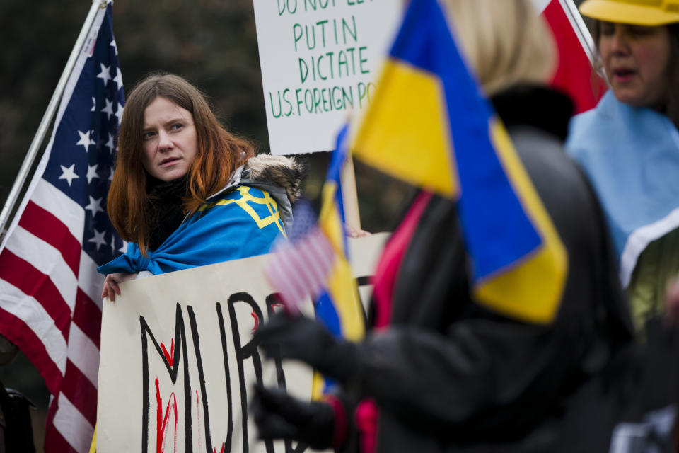 Yulia Kurka and others with the Ukrainian American and Polish American communities demonstrate in support Ukrainian anti-government protesters outside Independence Hall, Wednesday, Feb. 19, 2014, in Philadelphia. The violence on Tuesday was the worst in nearly three months of anti-government protests that have paralyzed Ukraine's capital, Kiev, in a struggle over the identity of a nation divided in loyalties between Russia and the West, and the worst in the country's post-Soviet history. (AP Photo/Matt Rourke)