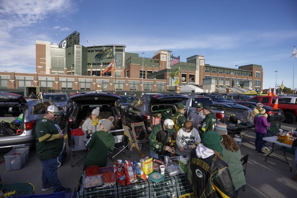 Fans outside Lambeau Field before an NFL football game between the Green Bay Packers and the Washington Football Team Sunday, Oct. 24, 2021, in Green Bay, Wis. (AP Photo/Matt Ludtke)