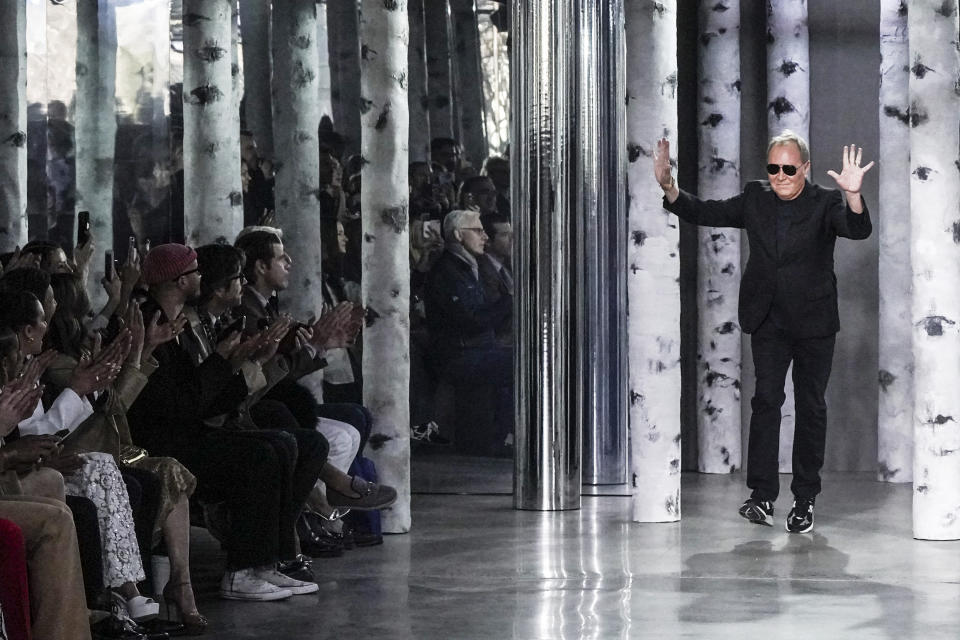 Fashion designer Michael Kors appears on the runway after showing his latest collection, during Fashion Week, Wednesday, Feb. 15, 2023, in New York. (AP Photo/Bebeto Matthews)