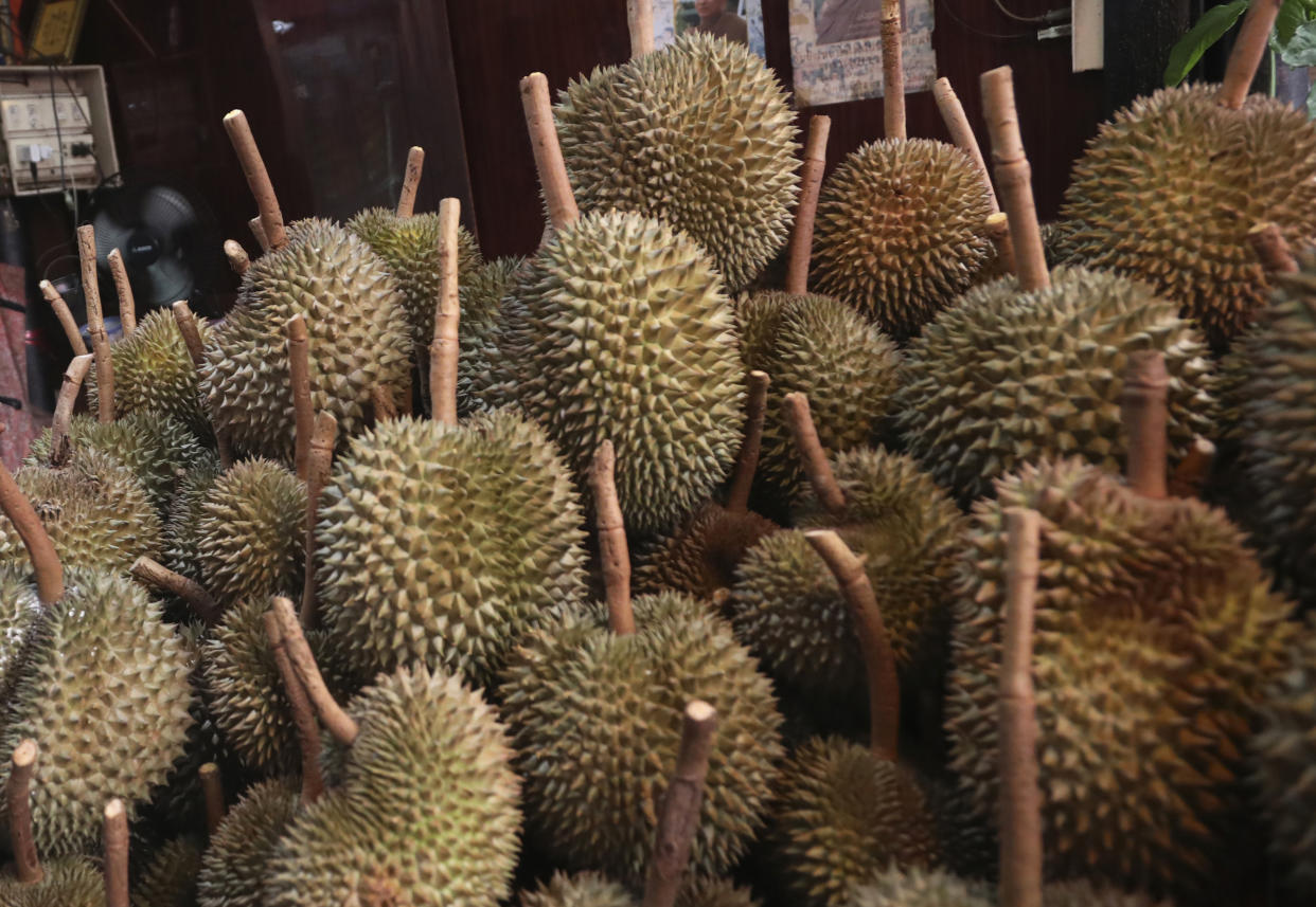 FILE - This Sept. 3, 2019, file photo shows durians for sale in Bangkok. Police in Hawaii are investigating the theft of fruit valued at about $1,000 including durian, which is known for its powerful odor. Two men entered a property in Hilo on the Big Island and removed 18 durian and other types of fruit on the night of Feb. 1, 2020, the Hawaii Police Department said. (AP Photo/Sakchai Lalit, File)