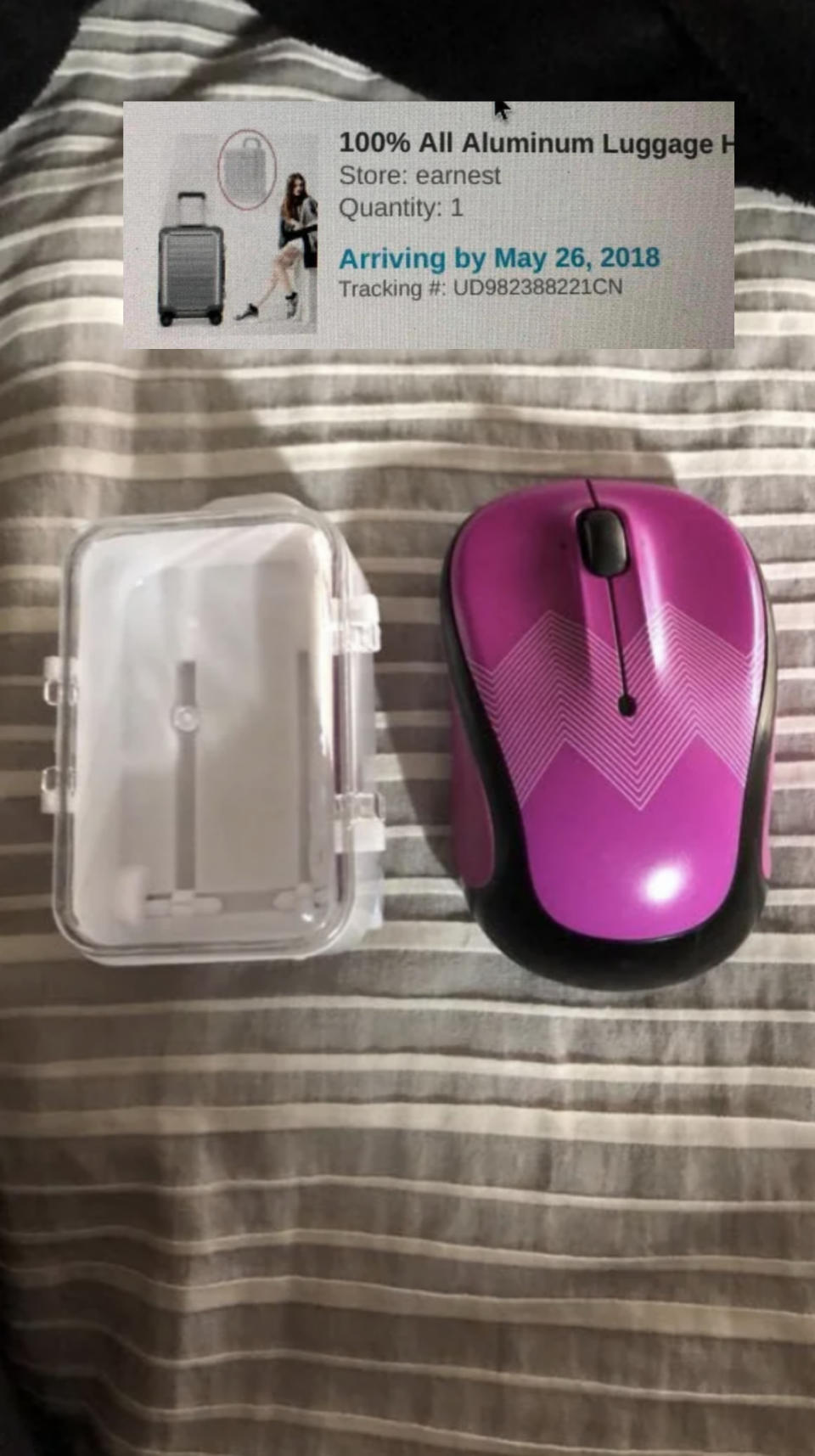 tiny suitcase replica the size of a computer mouse