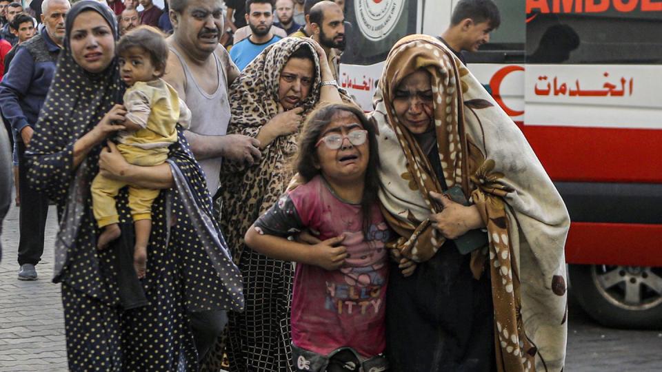 Wounded Palestinians arrive at al-Shifa hospital following Israeli airstrikes on Gaza City, Oct. 16, 2023. (Abed Khaled/AP)