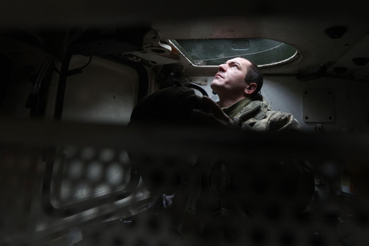 A Ukrainian tank crew member of the 21st Mechanised Brigade sits inside a German made Leopard 2A5 battle tank near the front line (AFP via Getty Images)