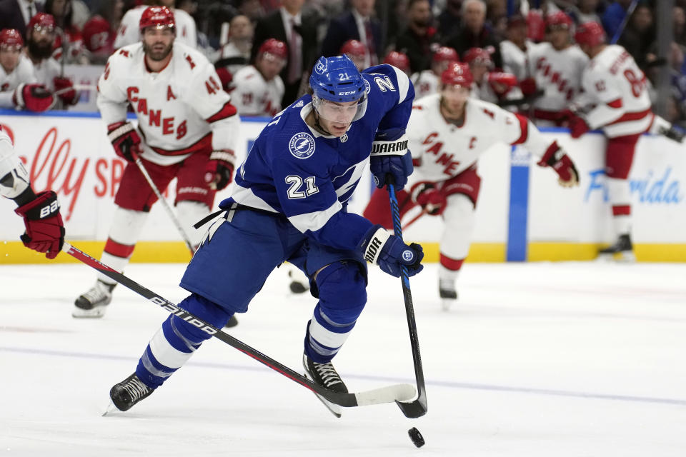 Tampa Bay Lightning center Brayden Point (21) breaks out ahead of the Carolina Hurricanes during the second period of an NHL hockey game Tuesday, Oct. 24, 2023, in Tampa, Fla. (AP Photo/Chris O'Meara)