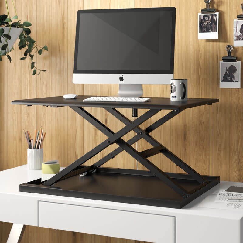 Find this <a href="https://fave.co/3cxIWeI" target="_blank" rel="noopener noreferrer">Westbury Pneumatic height adjustable standing desk converter</a> for $144 at <a href="https://fave.co/3cxIWeI" target="_blank" rel="noopener noreferrer">Wayfair</a>. <br /><strong>Ratings</strong>: 4.5 stars<br /><strong>Reviews</strong>: More than 50