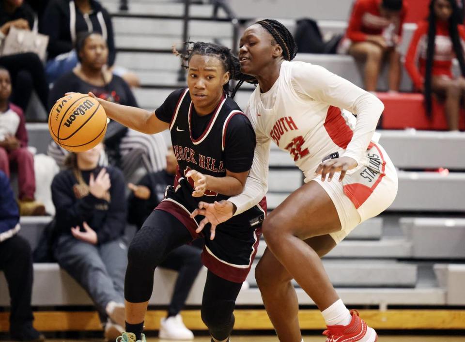 Rock Hill’s Emine Hollis tries to make it past South Pointe’s JaNyia Cunningham.