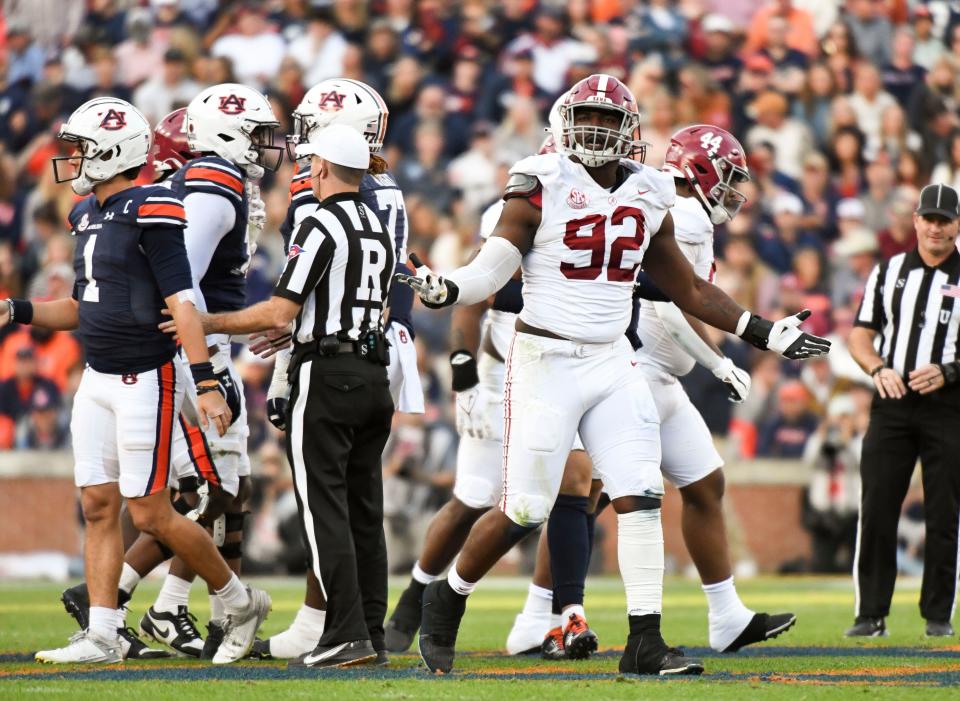 Alabama defensive lineman Justin Eboigbe (92) celebrates a sack of Auburn quarterback Peyton Thorne at Jordan-Hare Stadium.