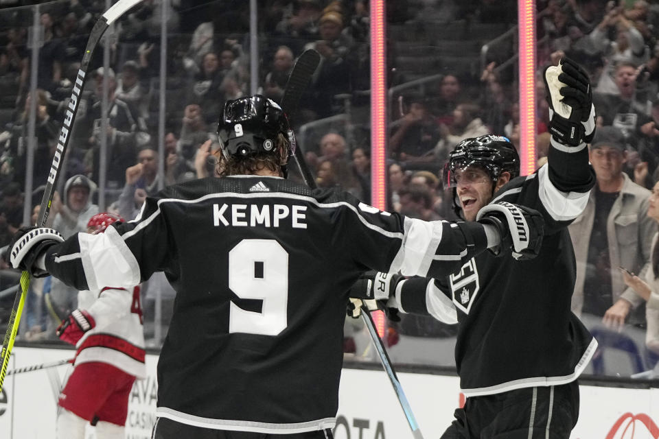 Los Angeles Kings center Anze Kopitar, right, celebrates his goal with center Adrian Kempe during the second period of an NHL hockey game against the Carolina Hurricanes Saturday, Oct. 14, 2023, in Los Angeles. (AP Photo/Mark J. Terrill)