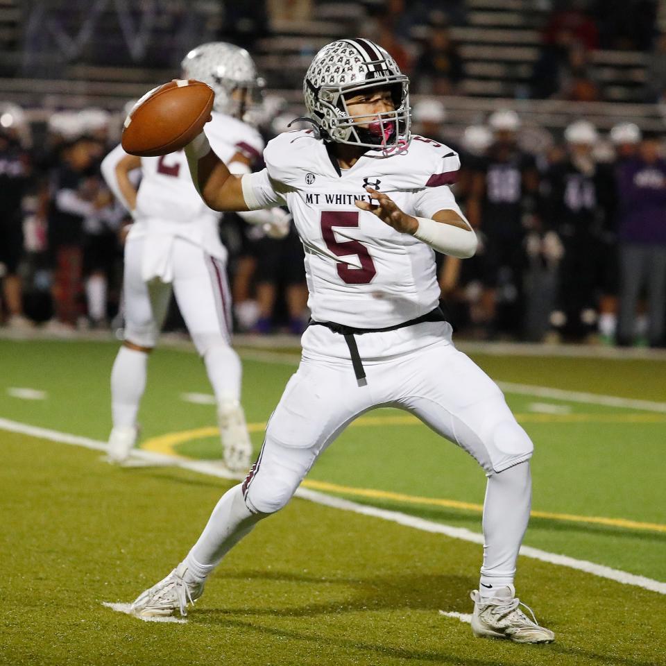 Mt. Whitney's Micah Rodriguez passes downfield against Mission Oak during their Central Section Division III high school quarterfinal football game in Tulare, Calif, Thursday, Nov. 9, 2023.