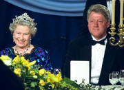 FILE - In this Saturday, June 4, 1994 file photo, Britain's Queen Elizabeth smiles, as she sits alongside President Bill Clinton at a dinner in the Guildhall in Portsmouth, England, commemorating the 50th anniversary of D-Day. (AP Photo/Doug Mills, File)