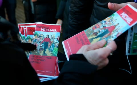 Pamphlets in support of Michael Jackson are handed out outside of the premiere of the "Leaving Neverland"  - Credit: AP