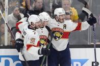 Florida Panthers' Anton Lundell (15) celebrates his goal against the Boston Bruins with Dmitry Kulikov (7) and Matthew Tkachuk (19) during the second period in Game 6 of an NHL hockey Stanley Cup second-round playoff series Friday, May 17, 2024, in Boston. (AP Photo/Michael Dwyer)