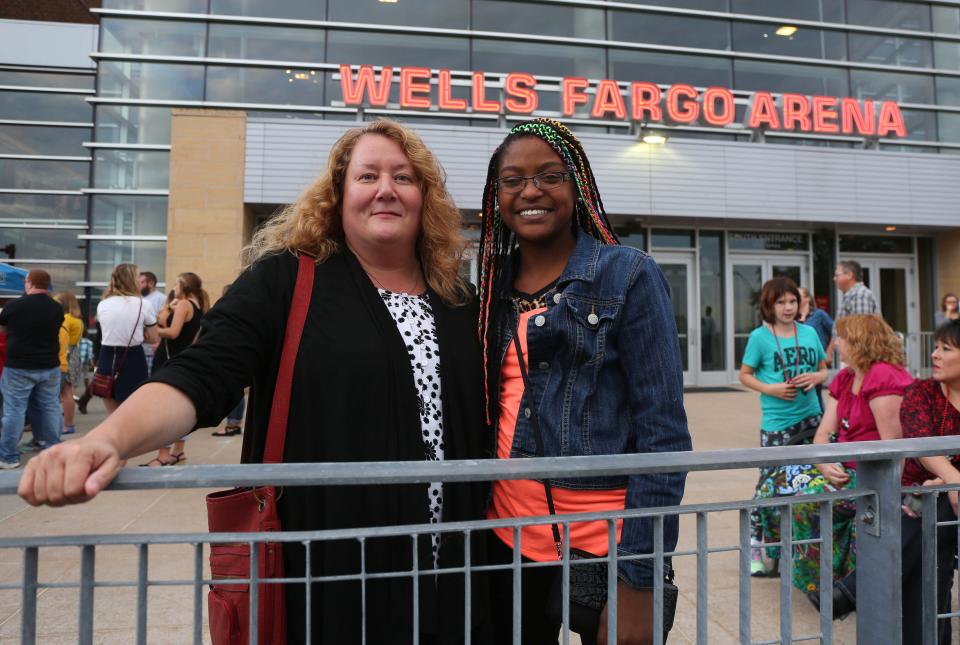 Michele Messerly and Betula Messerly of Conrad wait outside of Wells Fargo Arena to see Taylor Swift on Thursday, Oct. 8, 2015.