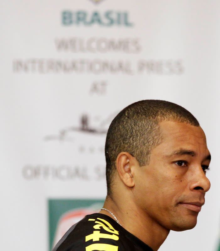 FILE PHOTO: Brazilian soccer player Gilberto Silva arrives for a news conference in Johannesburg